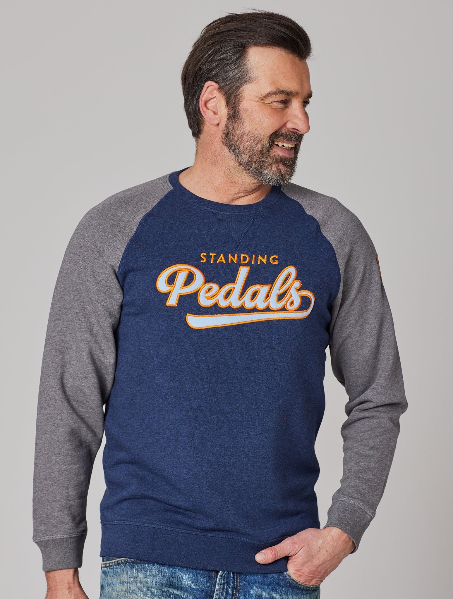 Premium Herren Raglan Sweater UNIVERSITY OF STANDING PEDALS