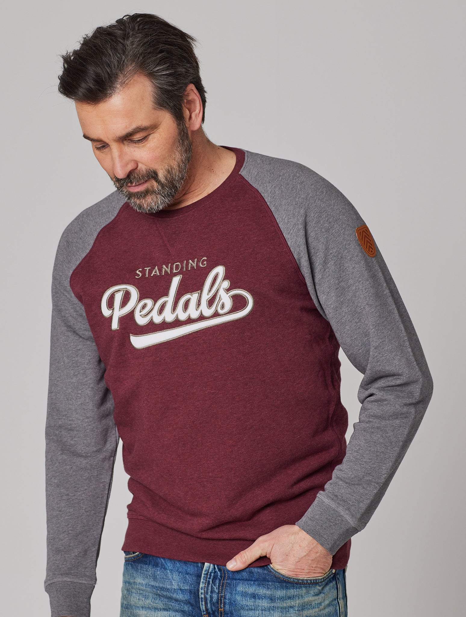 Premium Herren Raglan Sweater UNIVERSITY OF STANDING PEDALS